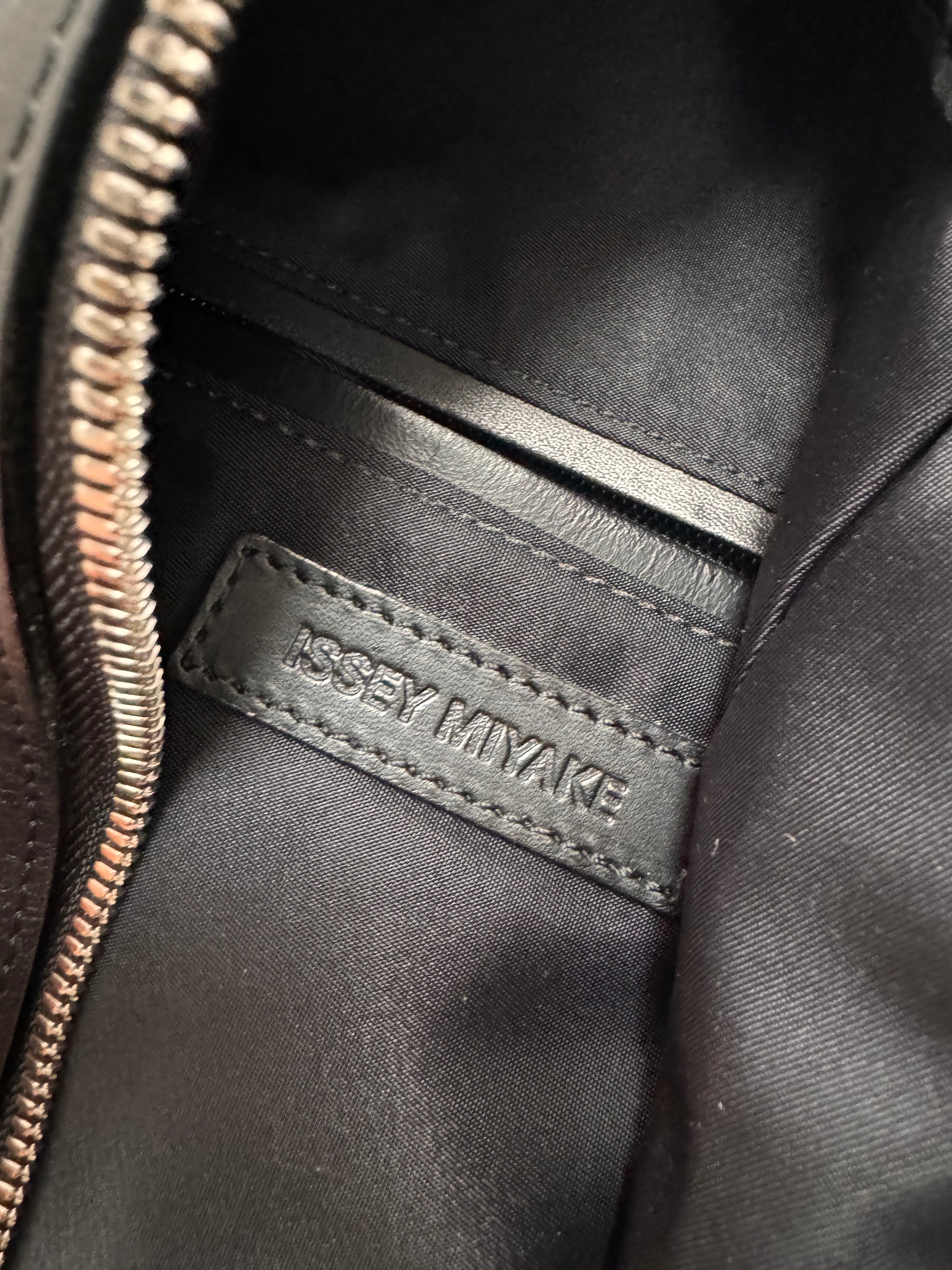 Issey Miyake Triangle Leather Backpack (OS)